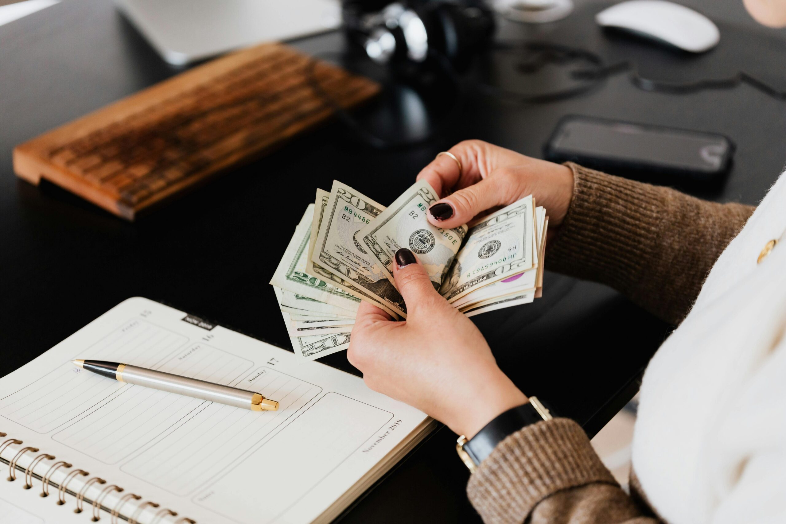 Image of person handling money.